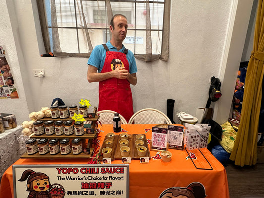 YoPo Chili booth at Happy Valley Weekend Market during rain June 2026